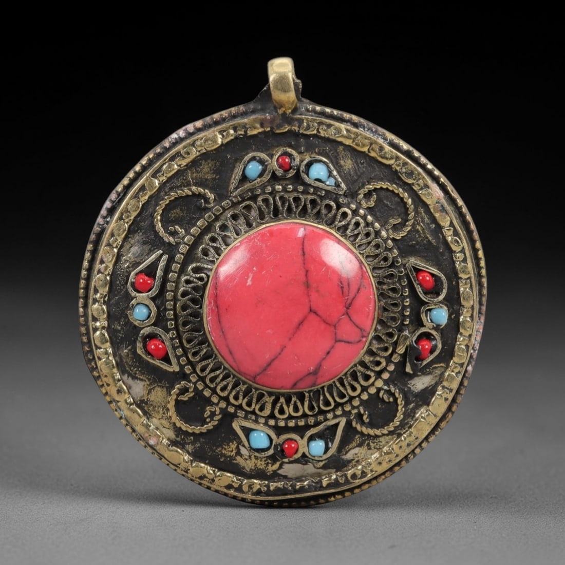A Tibetan Gilt-Metal Filigree and Red Composite Stone Gau Pendant, 20th Century, 90ZL (1 of 2)