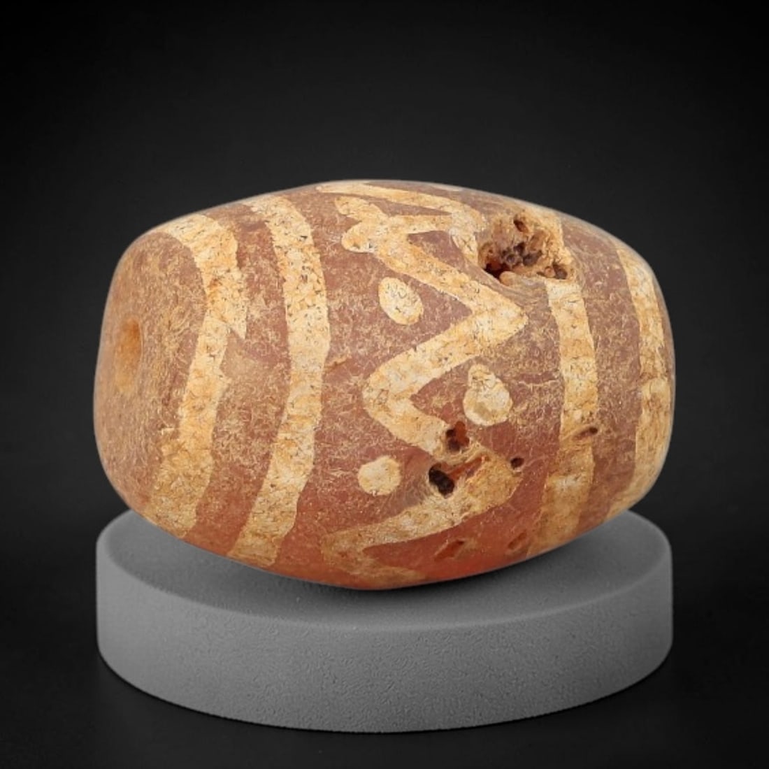 Ancient Carnelian Bead - Gandhara Etched Amulet, 57BD: This ancient Gandhara etched carnelian bead originates from archaeological excavations, crafted from rich reddish-brown carnelian with intricate hand-etched scroll and banded motifs characteristic of