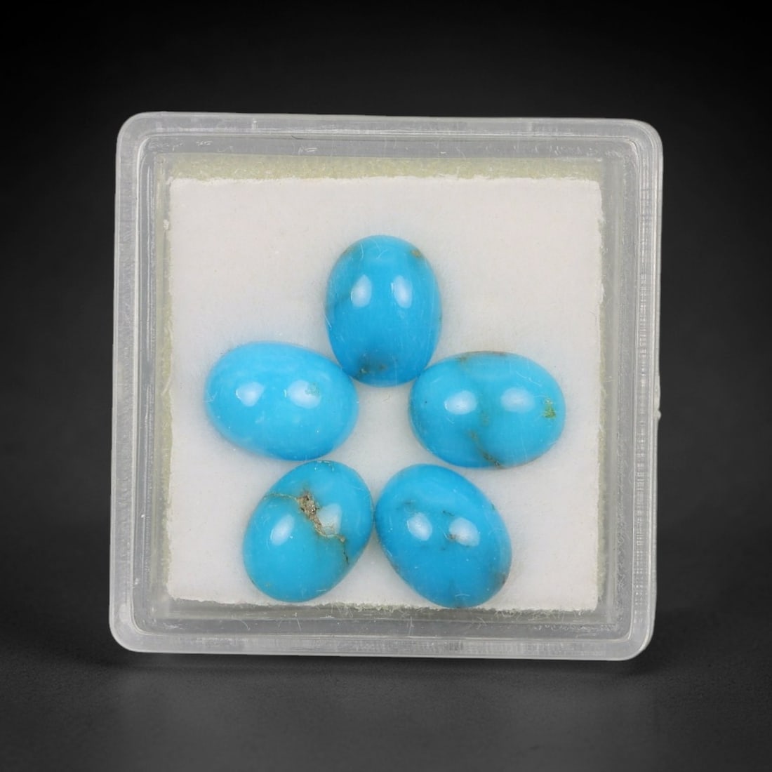 5.51 Carats Natural Sleeping Beauty Turquoise Cabochon Parcel - Natural Arizona Stones, 54XP: This curated parcel of five oval cabochon Sleeping Beauty turquoise gems showcases a vivid, uniform sky-blue hue, with subtle natural matrix inclusions that highlight their authentic, unaltered origin