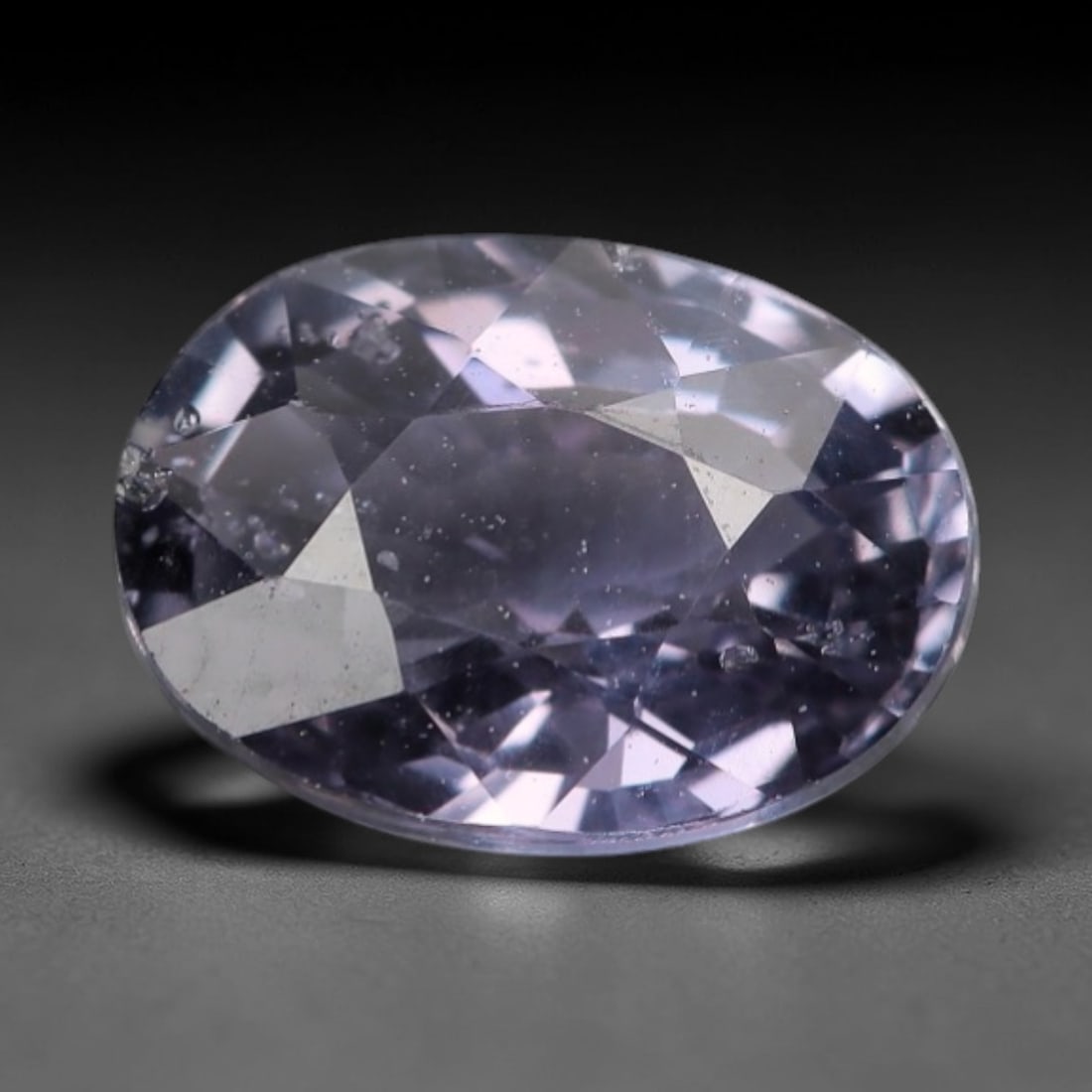 1.00 Carats Purple Violetish Sapphire - Natural Loose Gemstone, LZ278: This refined oval mixed-cut sapphire captivates with a delicate purple hue infused with soft violetish undertones, creating a luminous, ethereal appearance reminiscent of twilight skies and lavender b