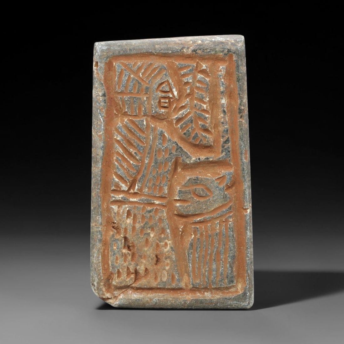 Near Eastern Schist Plaque - Tribal Art Figure & Animal Relief, 2ZA: Carved from schist, this rectangular plaque features a deeply incised relief depicting a stylized anthropomorphic figure positioned above a stylized animal form, executed with expressive tribal crafts
