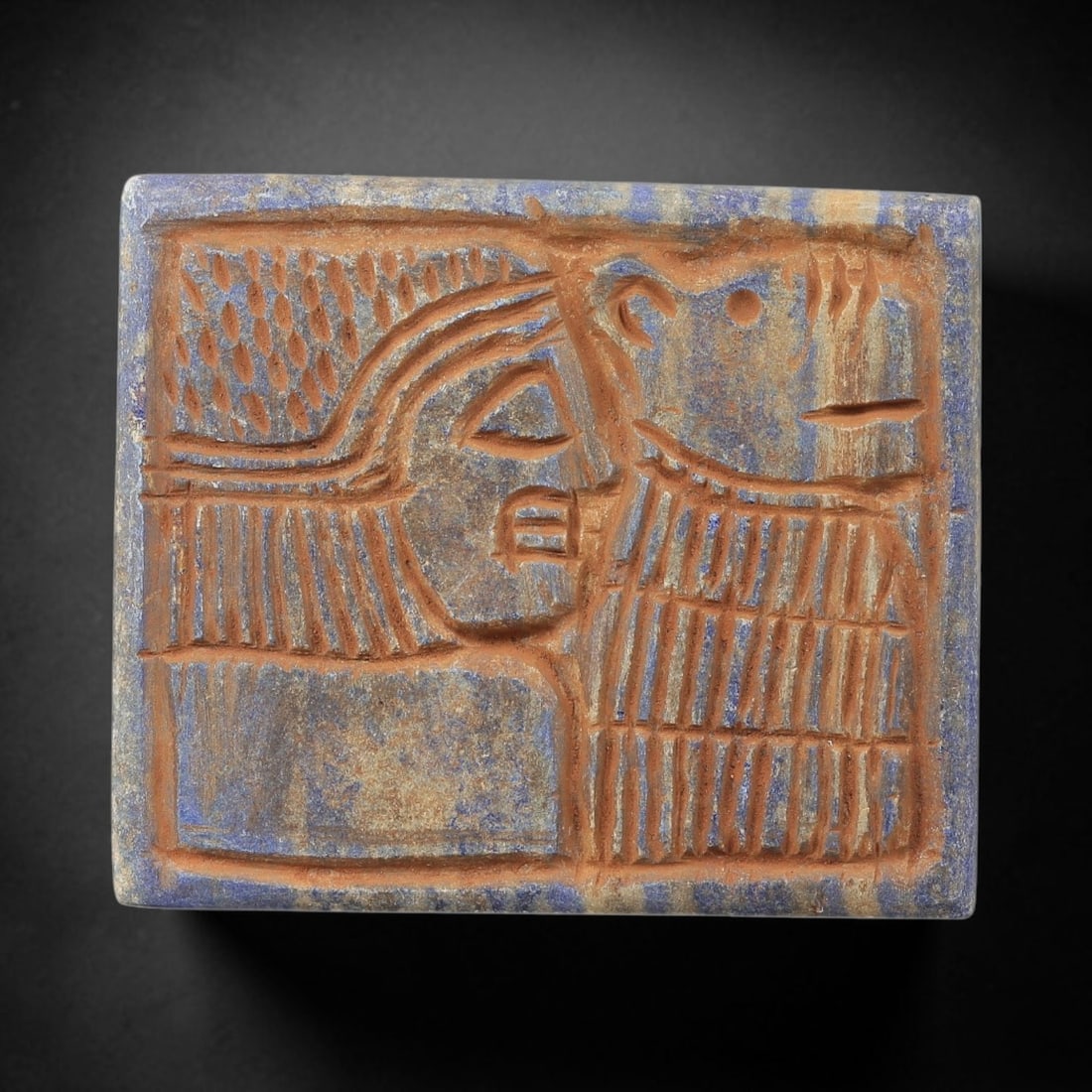 Near Eastern Lapis Lazuli Plaque - Tribal Art Figure & Animal Relief, 7BG: Carved from lapis lazuli, this square plaque features a divided relief composition depicting a stylized human figure alongside two animal motifs, executed in the linear, geometric style characteristic