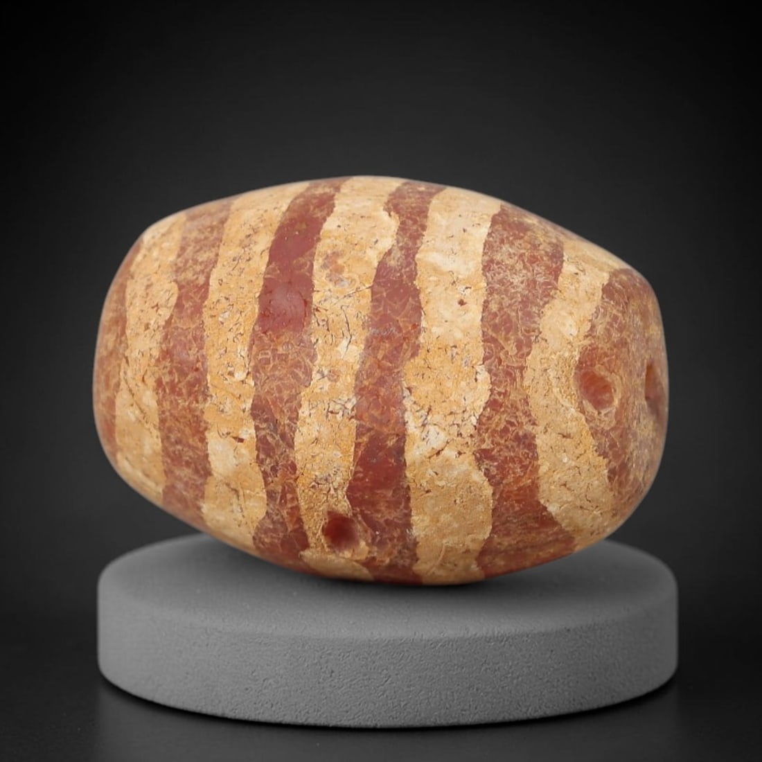 Ancient Carnelian Bead - Gandhara Etched Amulet, 1BE: This ancient Gandhara etched carnelian bead originates from archaeological excavations, crafted from rich red carnelian with hand-etched vertical banded motifs characteristic of Gandhara period lapida