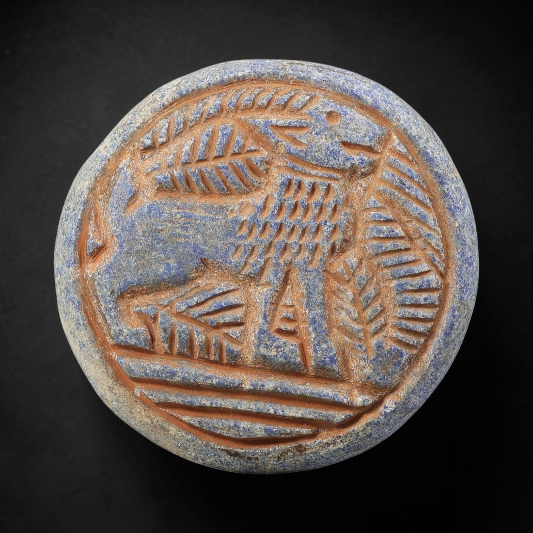 Near Eastern Lapis Lazuli Disc - Tribal Art Gazelle Relief, 90BF: Carved from lapis lazuli, this circular disc features a relief depiction of a stylized gazelle, rendered with incised linear detailing characteristic of Near Eastern tribal artistic traditions. The ga