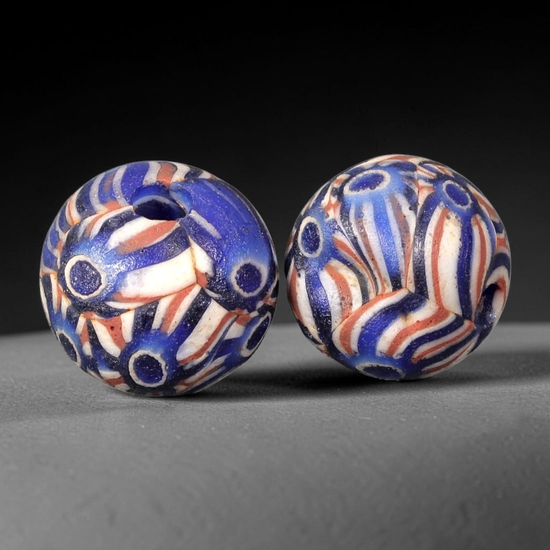 Old Glass Mosaic Eye Beads - Phoenician Style Spherical Beads, 95BG: Set of two spherical old glass mosaic beads, crafted from fused colored glass segments to create a complex repeating motif of concentric eyes and swirling stripes across each surface. Each bead featur