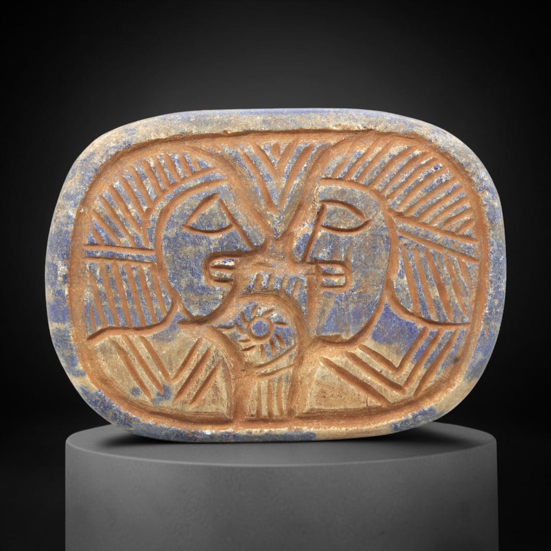 Near Eastern Lapis Lazuli Plaque - Tribal Art Two Figure Relief, 88ZY: Carved from lapis lazuli, this rectangular plaque features a deeply incised relief composition depicting two facing anthropomorphic figures. The figures are rendered in a stylized, geometric idiom, wi