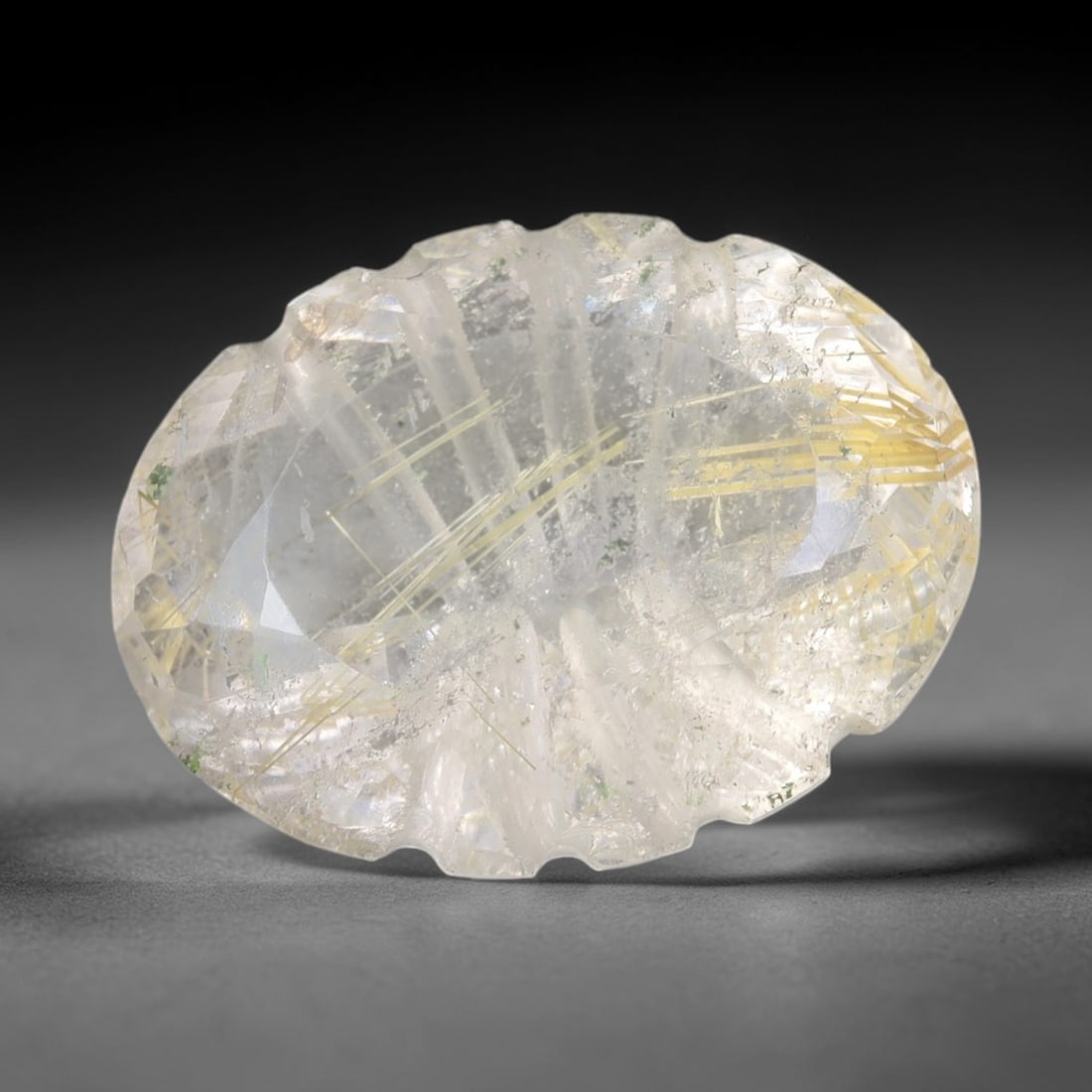 15.51 Carats Natural Rutilated Quartz - Carved Oval Faceted Loose Gemstone, 35XB: Natural carved oval-faceted rutilated quartz gemstone, a premium silicon dioxide specimen. This exceptional stone features stunning golden rutile needle inclusions suspended within a clear, transparen