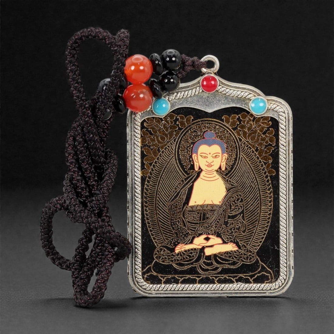 A Tibetan Metal and Painted Amulet, 20th Century, 16FH (1 of 2)