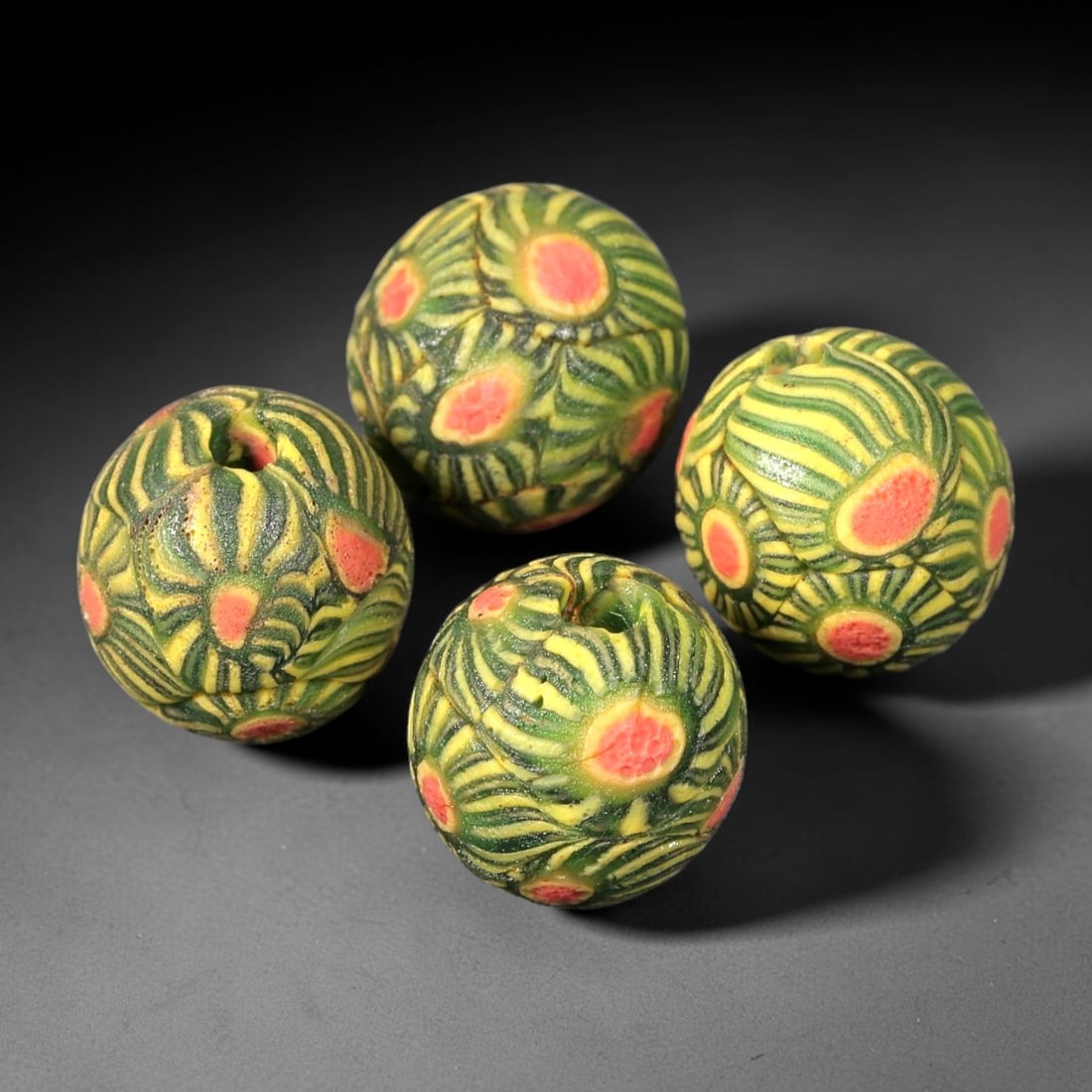 Old Glass Mosaic Beads - Phoenician Style Spherical Beads, 79BG: Set of four spherical old glass mosaic beads, crafted from fused colored glass segments to create a repeating floral eye motif across each surface. Each bead features raised concentric designs with pi