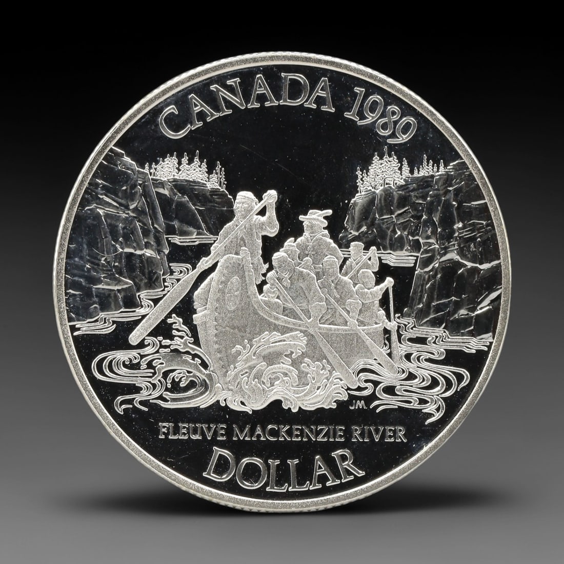 CANADA: Exploration Legacy - Mackenzie River Silver Dollar Coin, 1989, 36.07mm, 1ZJ: This silver dollar, struck by the Royal Canadian Mint in 1989, commemorates the 200th anniversary of Sir Alexander Mackenzie's historic 1789 expedition to the Mackenzie River, a pivotal moment in the