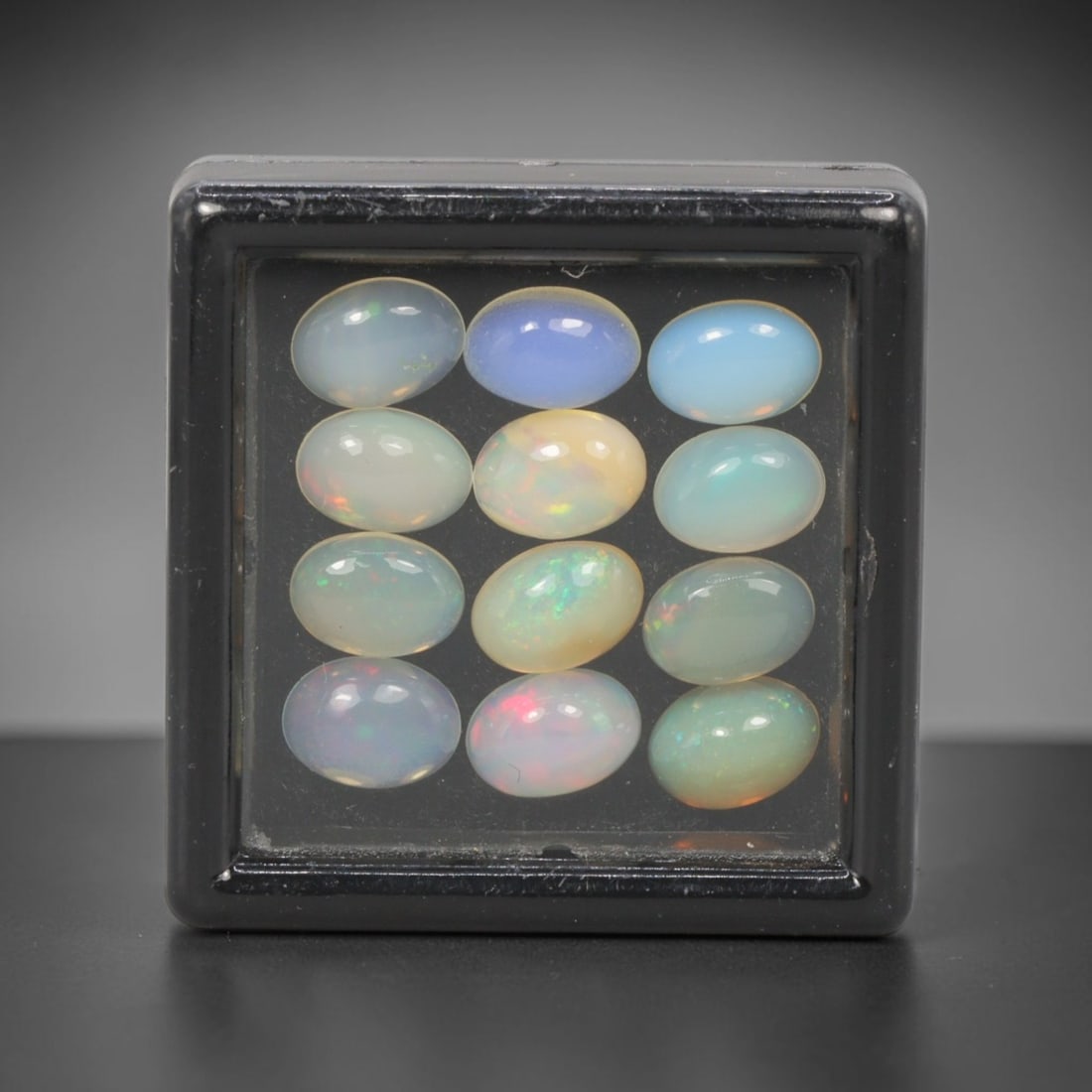 5.77 Carats Natural Ethiopian Welo Opal - Oval Cabochon Loose Gemstone Lot, 11WE: Natural oval cabochon Welo opal lot, sourced from the premium Welo deposit in Ethiopia. This curated collection features 12 exceptional opals with a stunning range of base tones-from icy sky blue, mil