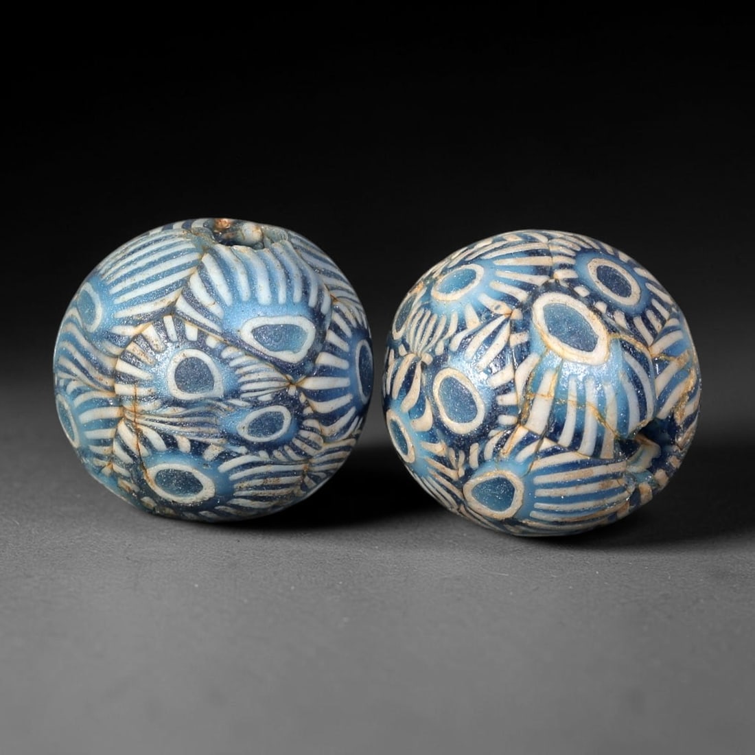 Old Glass Eye Beads - Phoenician Style Spherical Beads, 83BG: Set of two spherical old glass eye beads, crafted from fused colored glass segments to create a repeating concentric eye motif across each surface. Each bead features raised blue and white layered eye