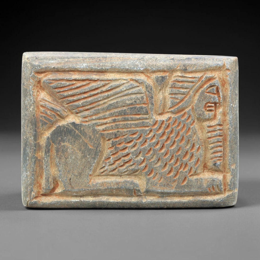 Near Eastern Schist Plaque - Tribal Art Figure & Animal Relief, 96ZY: Carved from natural schist stone, this Near Eastern tribal art plaque relief features a hand-carved composition of a stylized human figure alongside an animal motif, executed with incised linear and d