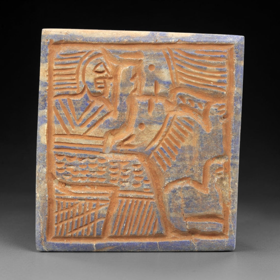 Near Eastern Lapis Lazuli Plaque - Tribal Art Figure & Mythical Creature Relief, 1ZA: Carved from lapis lazuli, this square plaque features a **5.5x5.1cm (2.17x2.01in)** relief composition depicting a stylized human figure in profile alongside a mythical winged creature, executed in th