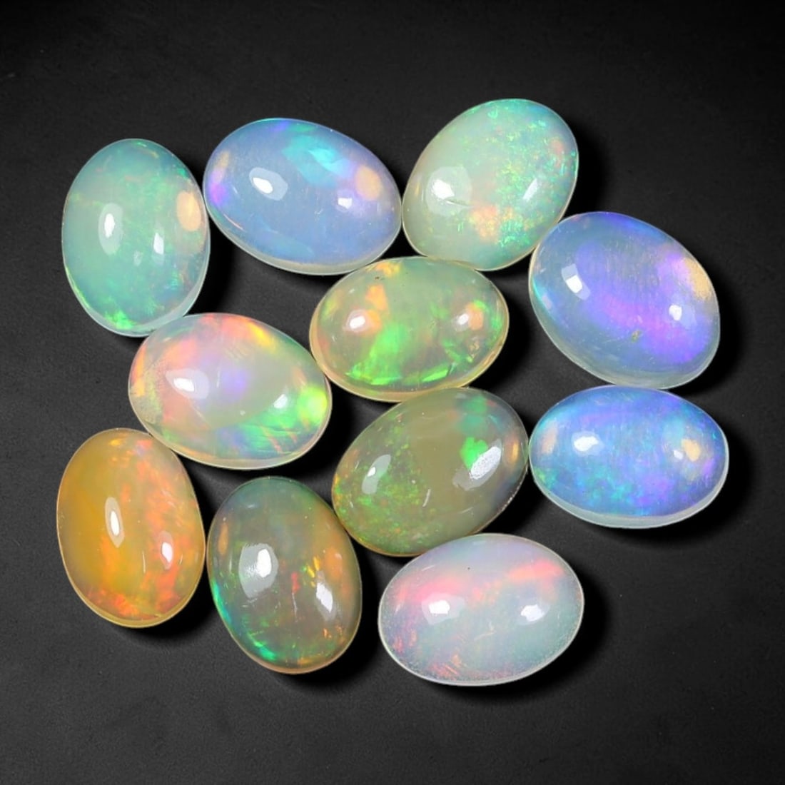 5.82 Carats Natural Ethiopian Welo Opal - Oval Cabochon Loose Gemstone Lot, 18WE: Natural oval cabochon Welo opal lot, sourced from the premium Welo deposit in Ethiopia. This curated collection showcases exceptional opals with vivid, full-spectrum play-of-color-flashing fiery reds,