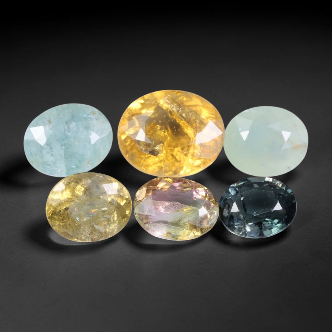 11.06 Carats Natural Multicolor Tourmaline - Oval Faceted Gemstone, 84WE: Oval faceted tourmaline gemstone, crafted from natural tourmaline material. The stone exhibits a spectrum of vivid natural hues, including sky blue, golden yellow, pale mint, champagne, bi-color pink-