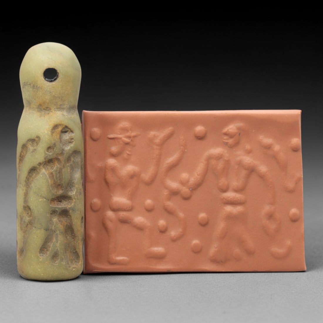 Ancient Serpentine Cylinder Seal - Mesopotamian, 41ZT: Carved from serpentine, this cylinder seal follows the classic cylindrical form of ancient Mesopotamian administrative and ritual artifacts. Attributed to the Bronze Age Mesopotamian cultures, this se
