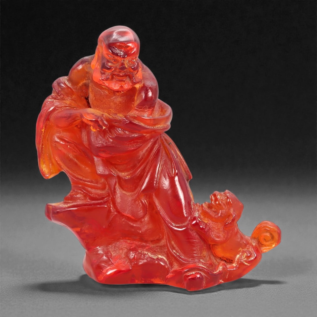 A Chinese Amber-Resin Figure of a Luohan, 20th Century, 40FH (1 of 2)