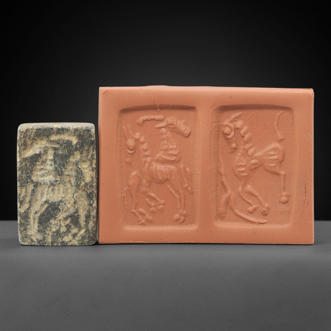 Ancient Schist Double Convex Stamp - Near Eastern Glyptic Art, 18ZQ: Carved from schist stone, this ancient Near Eastern double convex stamp features two raised relief carvings depicting stylized equine figures with detailed linear patterns. The stamp exhibits fine gly