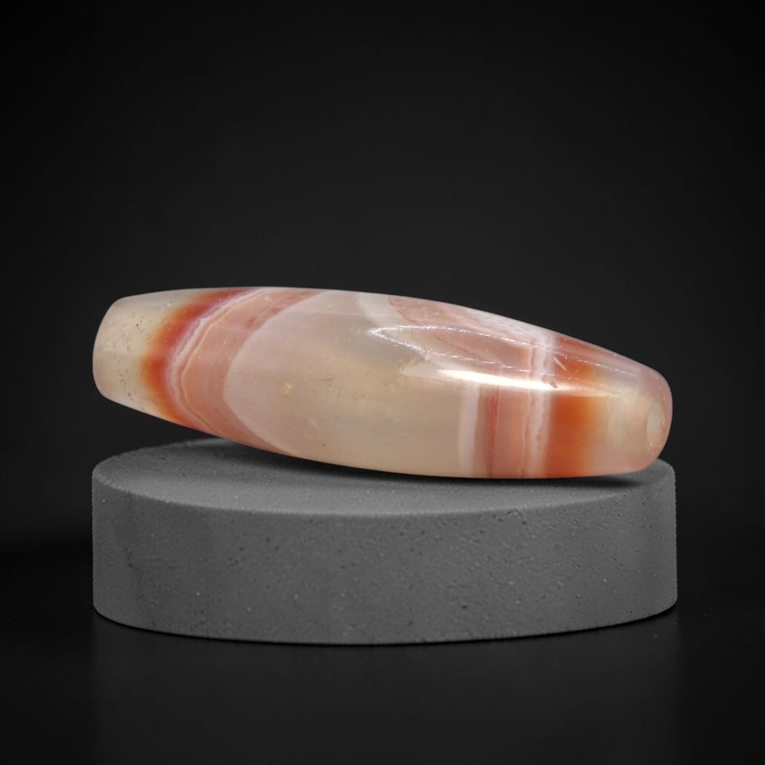 Ancient Agate Bead - Silk Road Carnelian Amulet, 97XW: This bead is fashioned from translucent banded carnelian-agate featuring vibrant fiery-orange, creamy white, and rose-red striations that swirl in a classic cloud pattern. It exemplifies the refined l