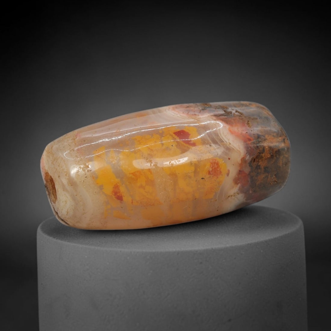 Ancient Agate Bead - Indus Valley Banded Carving, 91WJ: This artifact is crafted from banded agate, showcasing vibrant, contrasting hues of sunny yellow and deep red embedded within a creamy, translucent base, with striking dendritic mineral inclusions acr