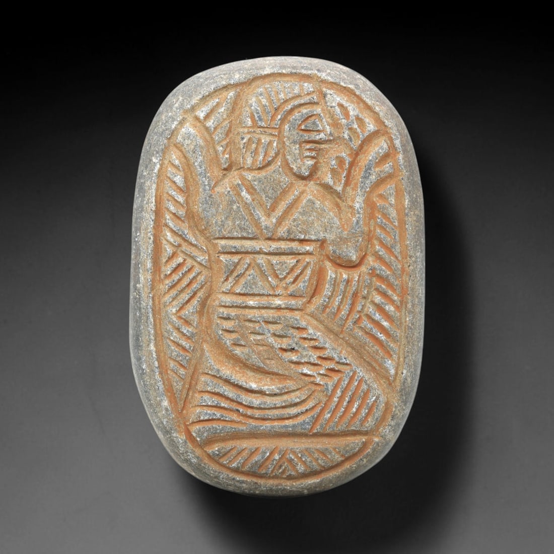 Near Eastern Schist Plaque - Tribal Art Figure Relief, 77ZY: Carved from natural schist stone, this Near Eastern tribal art plaque relief features a hand-carved oval form depicting a stylized human figure in a dynamic, raised-arm pose, executed with incised lin