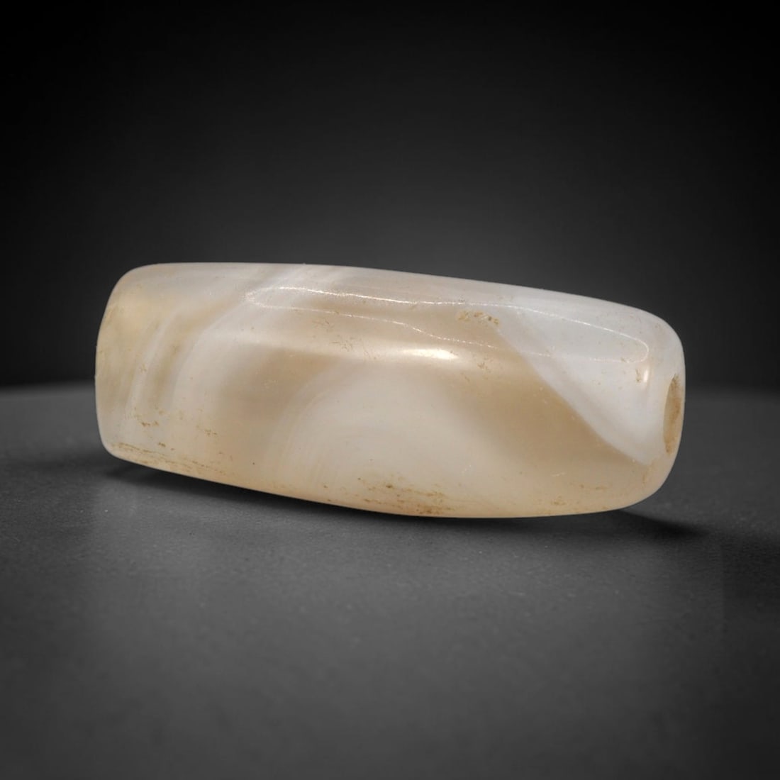 Ancient Banded Agate Bead - Western Asiatic Silk Road Amulet, 94XW: This bead is crafted from translucent banded agate with soft swirling stratification and a warm creamy base, characteristic of ancient lapidary craftsmanship from the Western Asiatic and Silk Road cul
