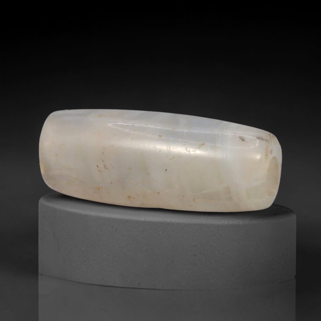 Ancient Banded Agate Bead - Silk Road Western Asiatic Amulet, 69XW: This bead is carved from translucent banded agate with a pale milky base and fine parallel stratification, characteristic of ancient lapidary craftsmanship from the Western Asiatic and Silk Road cultu