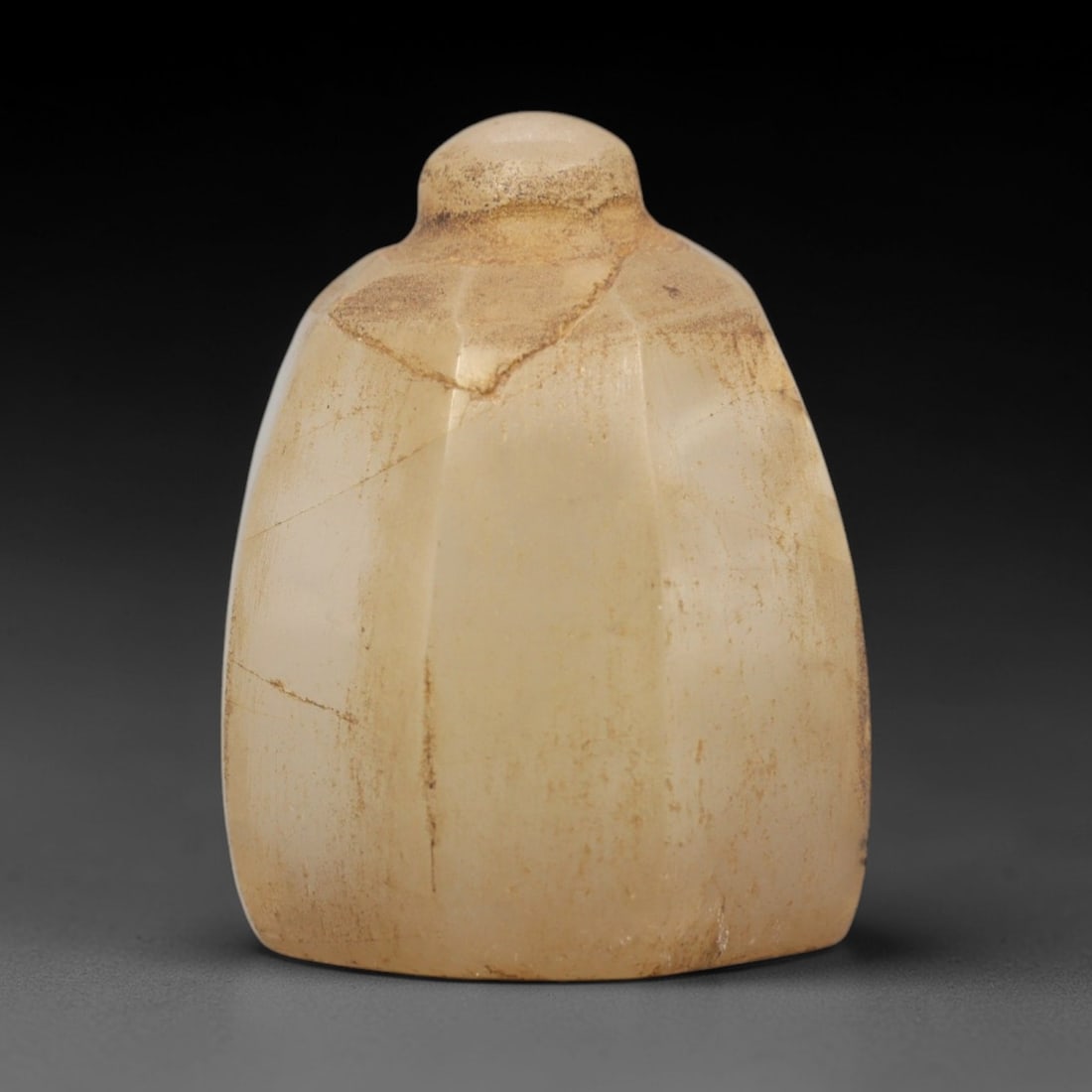 Ancient Chalcedony Relic - Silk Road Artifact, 78ZR: Carved from translucent pale chalcedony, this relic features a tapering, faceted form with a rounded knob at the apex and a flat base, exhibiting subtle natural veining and internal fractures characte