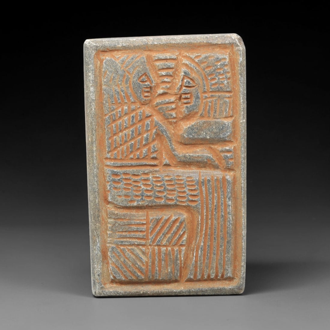Near Eastern Schist Plaque - Tribal Art Two Figure Relief, 19ZA: Carved from solid schist, this rectangular plaque features a deeply incised relief with two stylized anthropomorphic figures, executed with precise linear detailing characteristic of Near Eastern trib