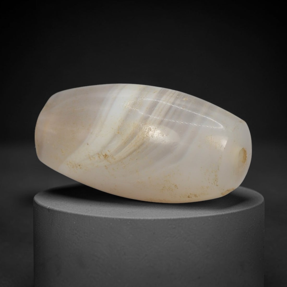 Ancient Agate Bead - Indus Valley Bactrian Amulet, 51XT: This bead is carved from naturally banded agate, showcasing precise lapidary workmanship consistent with ancient bead-making traditions of the Indus Valley and Bactrian regions. The elongated bicone f