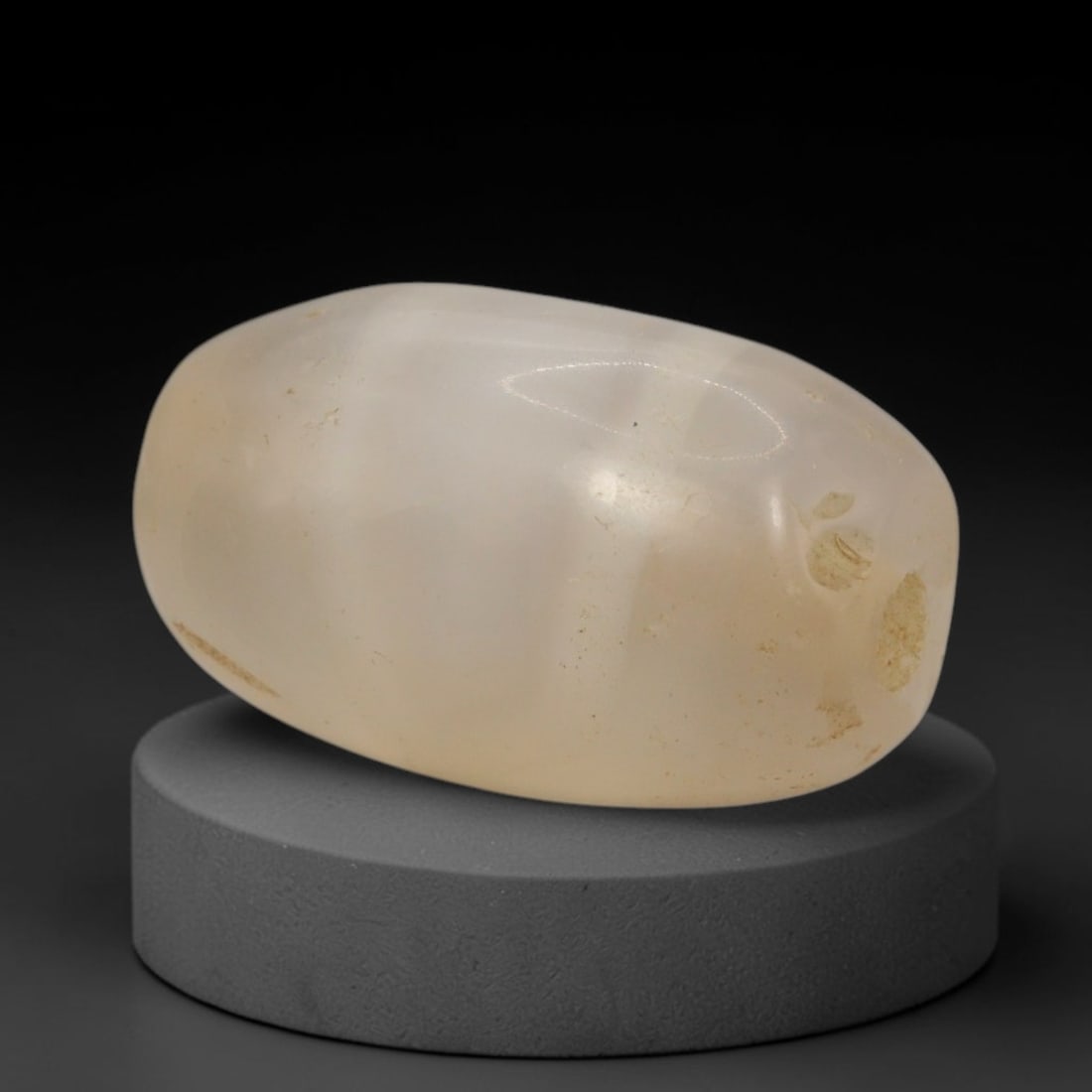 Ancient Agate Bead - Indus Valley Chalcedony Barrel Bead, 13XW: This bead is carved from translucent creamy-white chalcedony agate, shaped into a smooth, robust barrel form with a precisely centered axial drill hole, characteristic of Indus Valley (Harappan) lapid