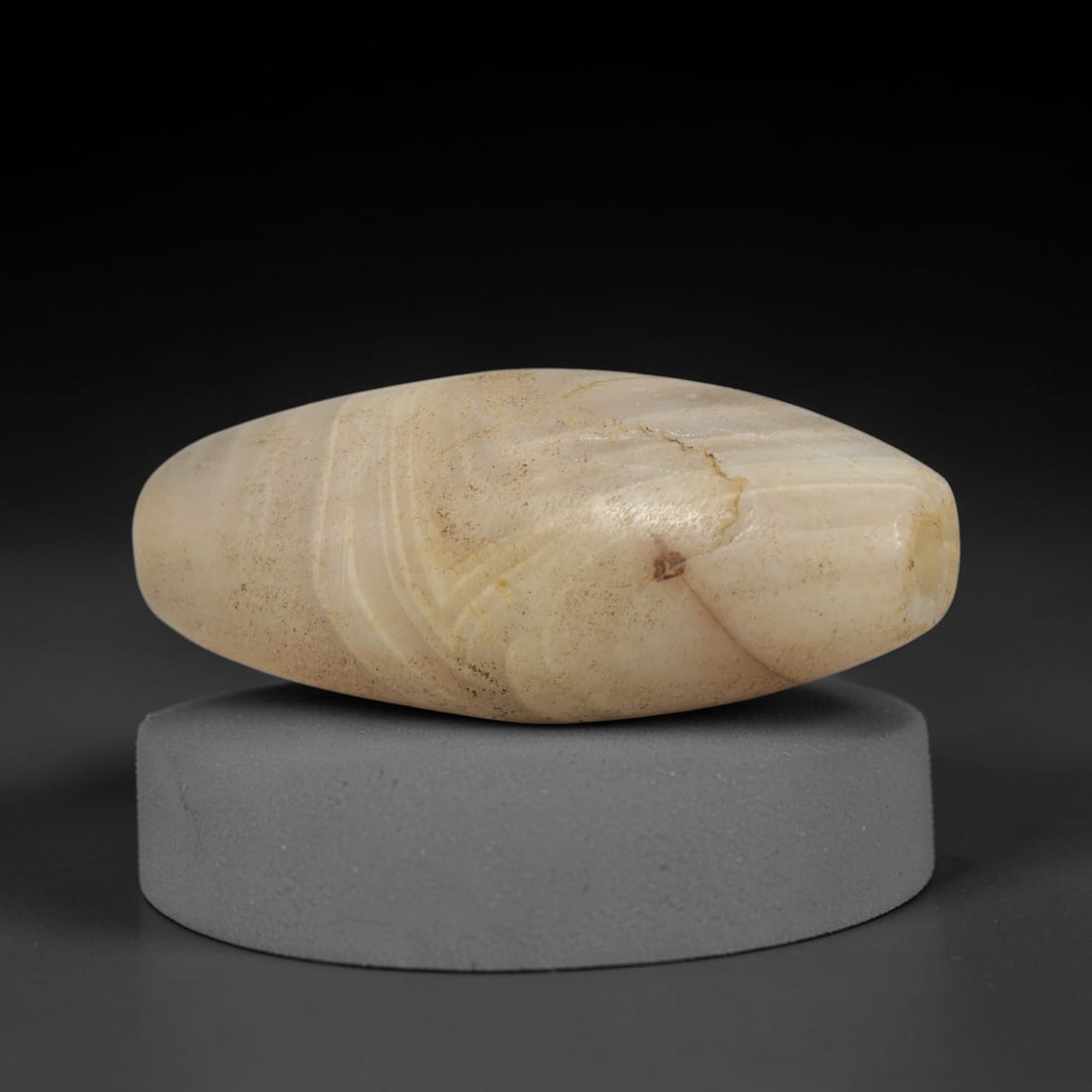 Ancient Agate Bead - Indus Valley Bactrian Pendant, 53XT: This bead is carved from naturally banded agate, exhibiting fine lapidary workmanship consistent with ancient bead-making traditions of the Indus Valley and Bactrian regions. The elongated bicone form