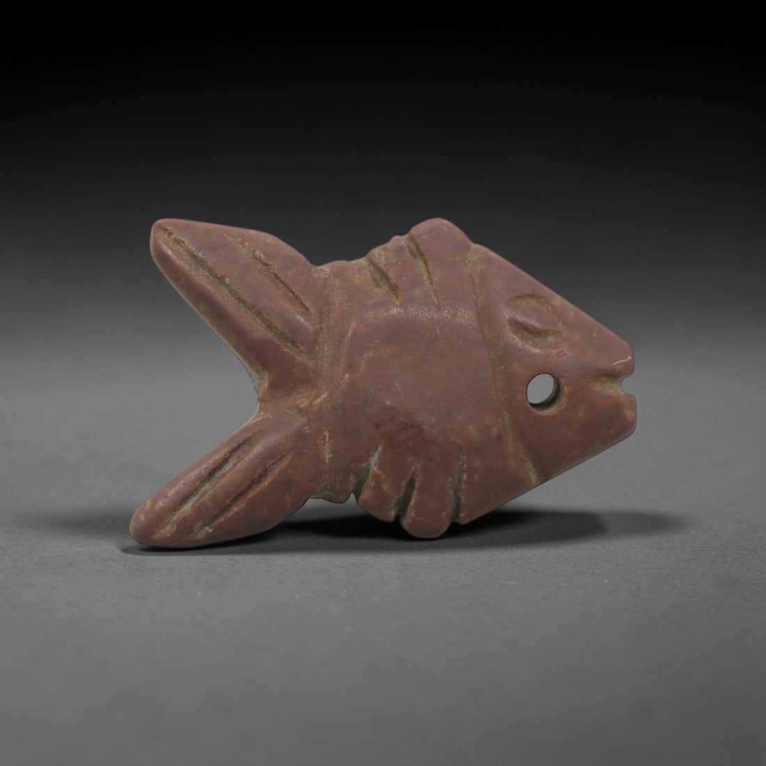 Ancient Red Stone Fish-Form Pendant - Near Eastern Ritual Amulet, 14XQ: Priced to reflect its endearing fish-form design, rich red stone material, Near Eastern cultural significance, and well-preserved condition with natural patina.