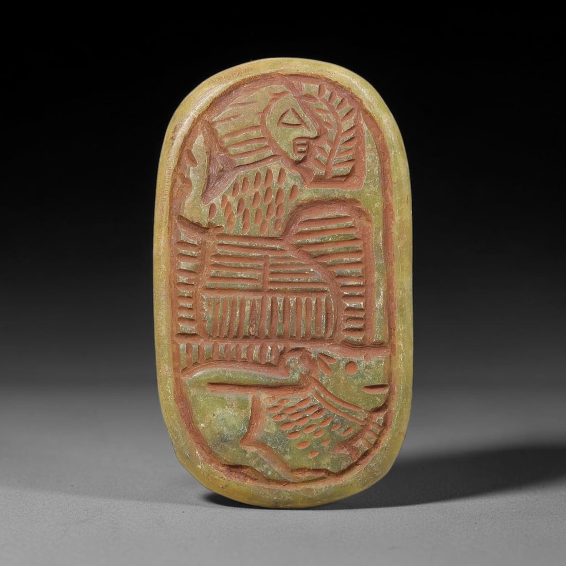 Near Eastern Serpentine Plaque - Tribal Art Figure & Animal Relief, 53BF: Carved from serpentine, this oval-shaped plaque features a deeply incised relief composition with a stylized human figure and a quadrupedal animal form, rendered in a bold, linear tribal style. The in