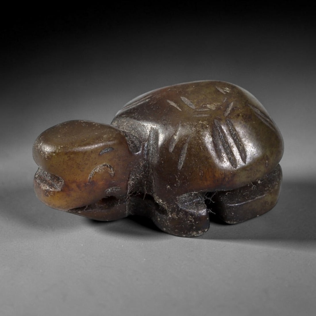 Antique Qing Jade Tortoise Amulet - Chinese Animal Figurine, 44XT: Carved from a dense, dark greenish-brown jade with a smooth, polished surface and subtle internal veining, this miniature tortoise amulet features incised linear motifs on the shell to denote scute pa