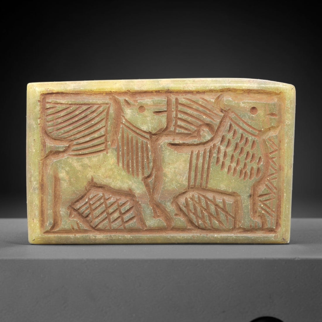 Near Eastern Serpentine Plaque - Tribal Art Two Animal Relief, 71ZY: Carved from serpentine, this rectangular plaque features a deeply incised relief depicting two stylized animal forms positioned side-by-side, executed with expressive tribal craftsmanship characterist