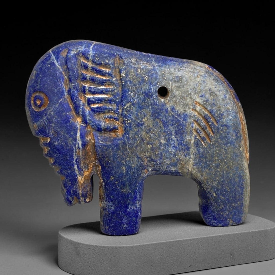 Antique Lapis Elephant Effigy - Near Eastern Tribal Art, 160g, 2AA: Carved from rich lapis lazuli with deep cobalt-blue hues accented by natural calcite veining and golden pyrite inclusions, this antique elephant effigy exhibits skilled tribal lapidary craftsmanship t