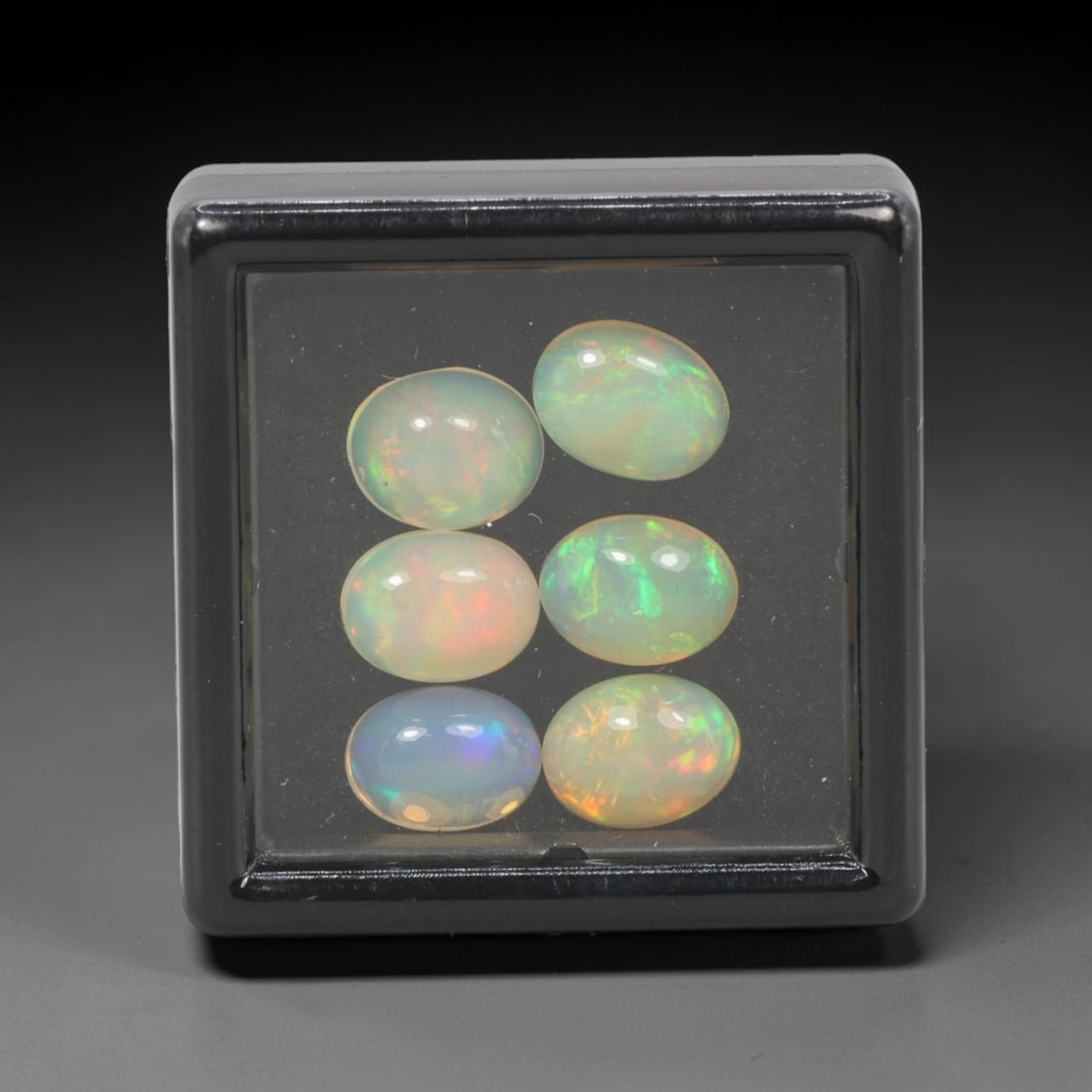 5.73 Carats Natural Ethiopian Welo Opal - Oval Cabochon Loose Gemstone Lot, 3WE: Natural oval cabochon Welo opal lot, sourced from the premium Welo deposit in Ethiopia. This curated collection features 12 exceptional opals with a stunning range of base tones-from icy sky blue, mil