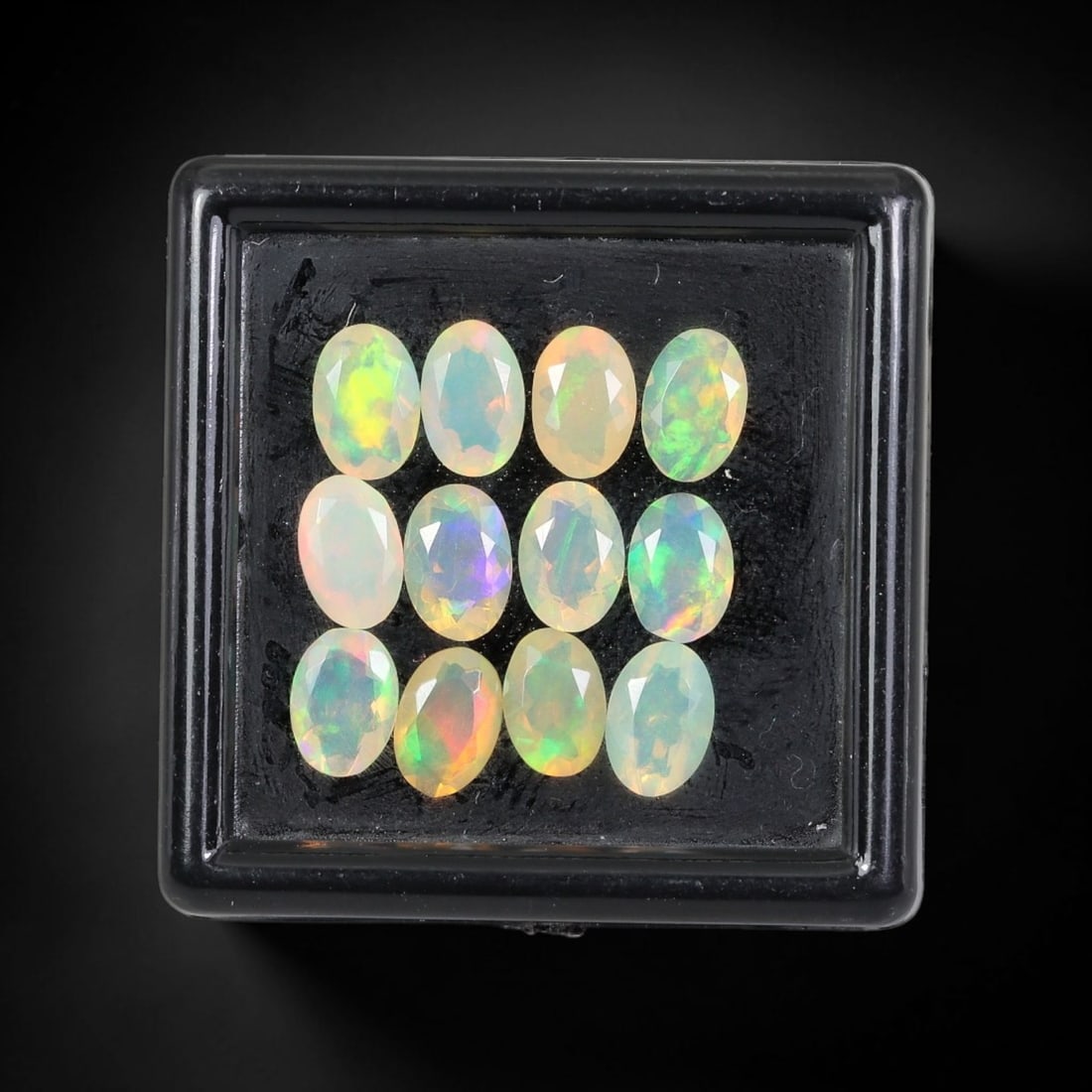 3.50 Carats Natural Ethiopian Welo Opal - Oval Faceted Loose Gemstone Lot, 59WE: Natural oval-faceted Welo opal lot, sourced from the premium Welo deposit in Ethiopia. This curated collection features exceptional opals with vivid, full-spectrum play-of-color-flashing fiery reds, w