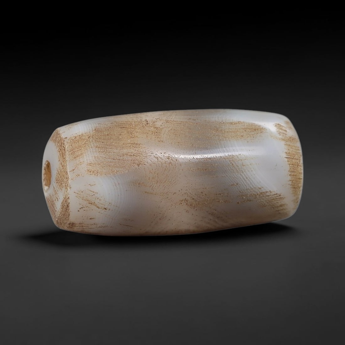 Ancient Agate Bead - Silk Road Cylinder Amulet, 78BD: Carved from banded agate, the bead features a smooth cylindrical barrel form with a polished surface that highlights the stone's pale milky base and subtle internal banding, with heavy earthy mineral