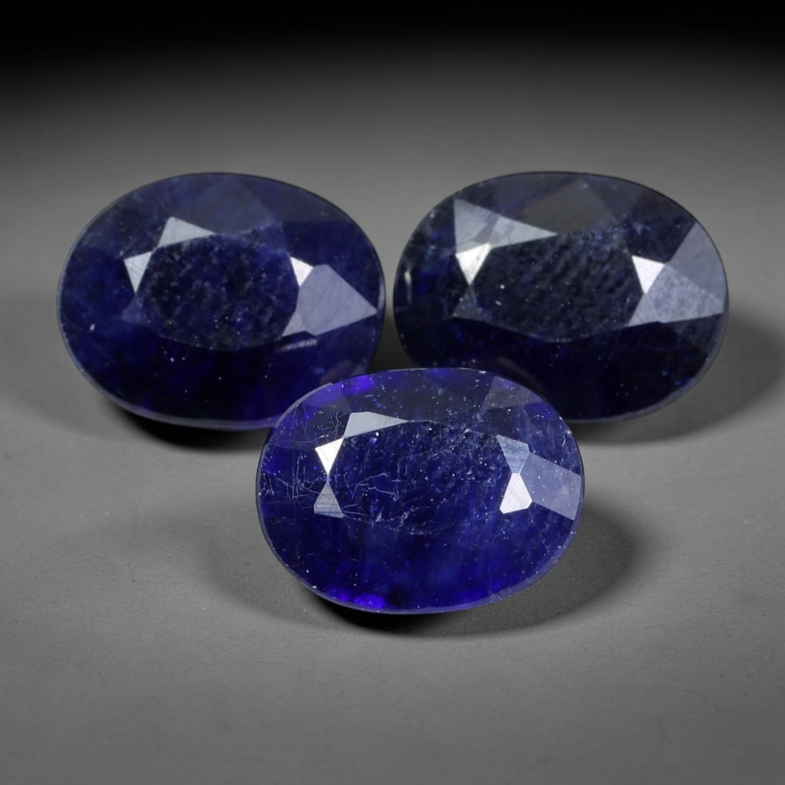 5.82 Carats Blue Sapphire - Oval Faceted Gemstone, 88WE: Oval faceted blue sapphire gemstone, crafted from sapphire material. The stone exhibits a rich, deep royal blue hue with subtle tonal variations and natural internal inclusions characteristic of genui