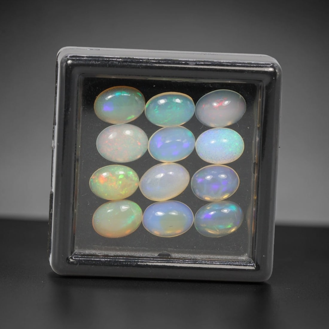 5.28 Carats Natural Ethiopian Welo Opal - Oval Cabochon Loose Gemstone Lot, 14WE: Natural oval cabochon Welo opal lot, sourced from the premium Welo deposit in Ethiopia. This curated collection features 12 exceptional opals with a stunning range of base tones-from icy sky blue, mil