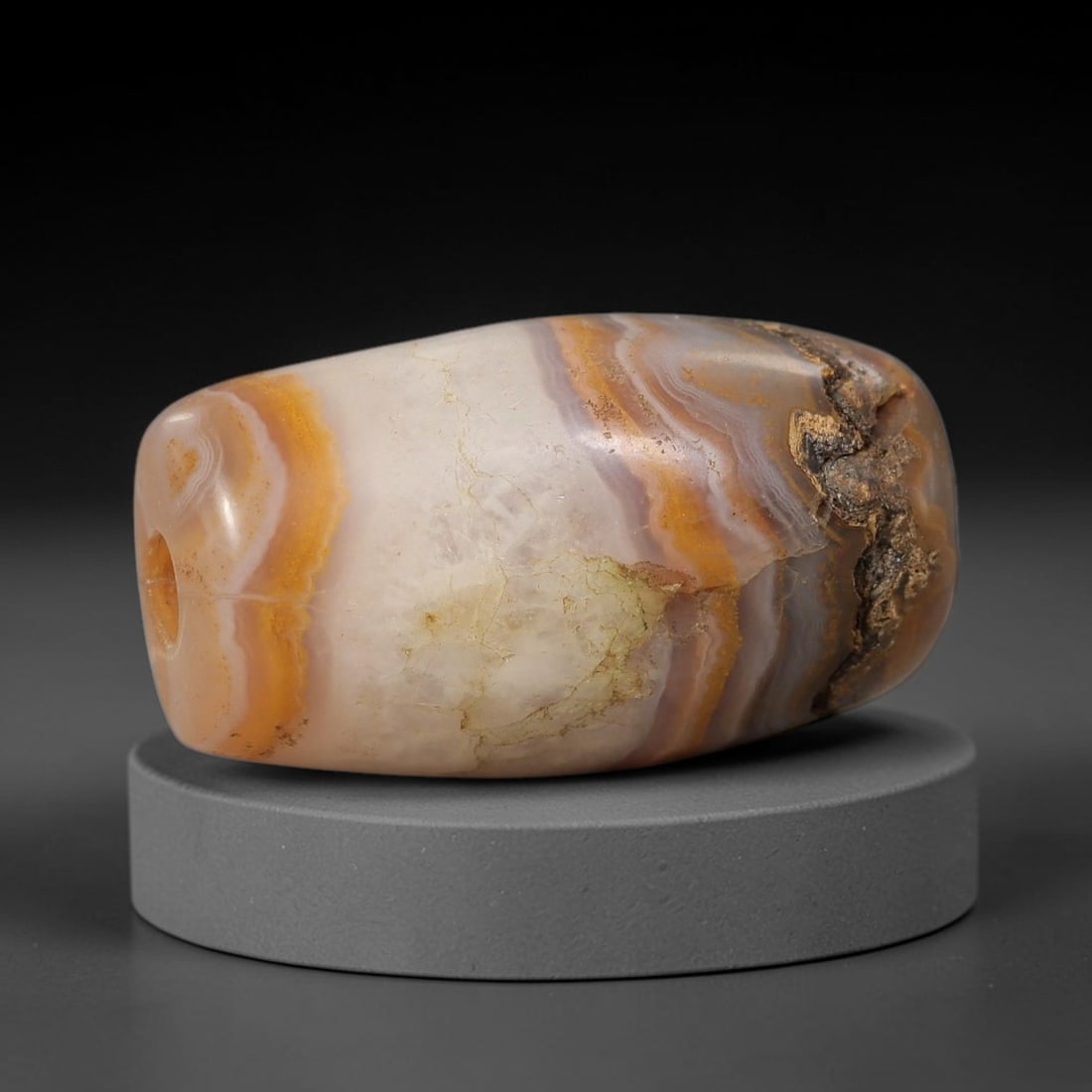 Ancient Agate Bead - Silk Road Cylinder Amulet, 86BD: Carved from banded agate, the bead features a cylindrical barrel form with a smooth, polished surface that highlights the stone's natural concentric banding, ranging from creamy white and warm amber t