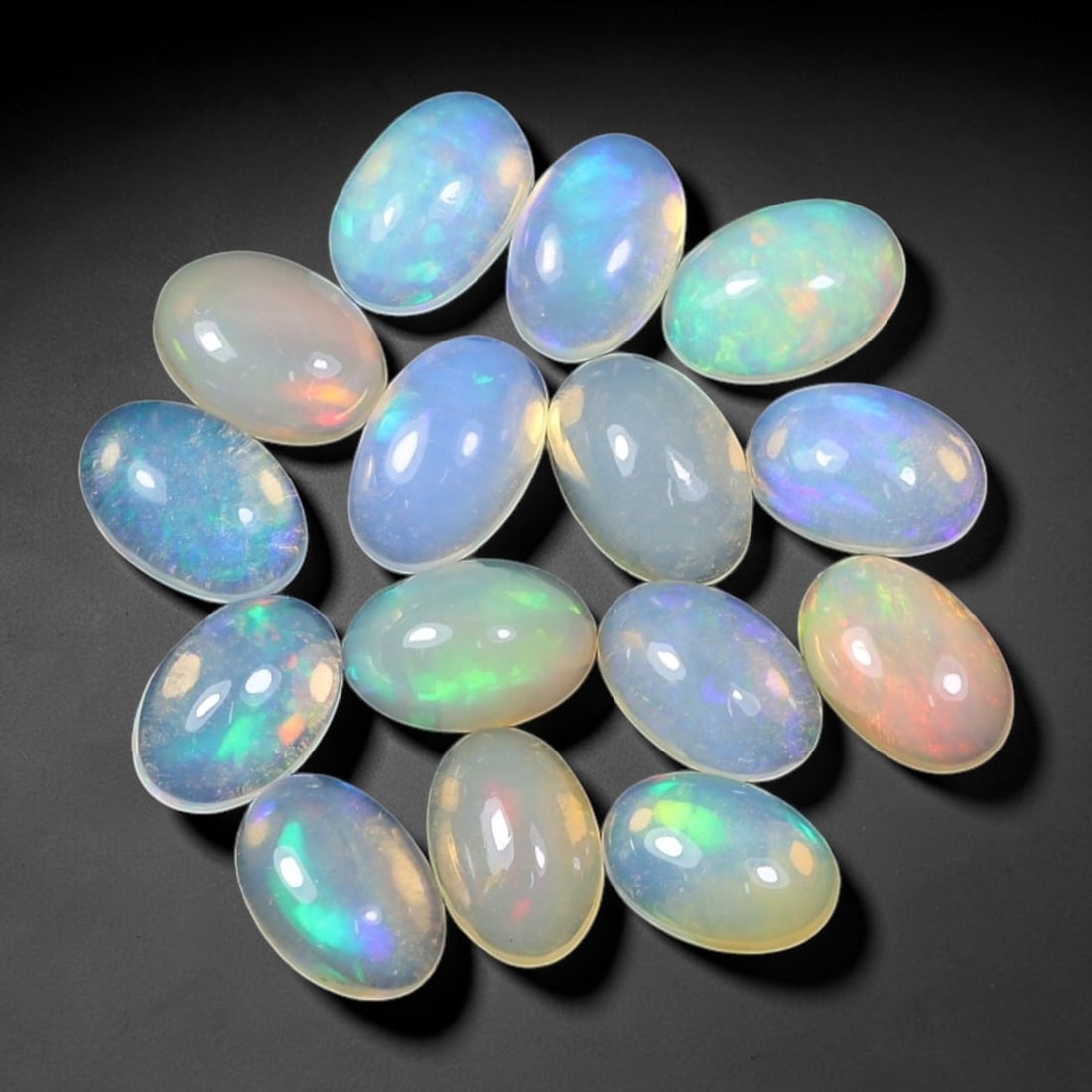 4.84 Carats Natural Ethiopian Welo Opal - Oval Cabochon Loose Gemstone Lot, 61WE: Natural oval cabochon Welo opal lot, sourced from the premium Welo deposit in Ethiopia. This curated collection showcases exceptional opals with vivid, full-spectrum play-of-color-flashing fiery reds,