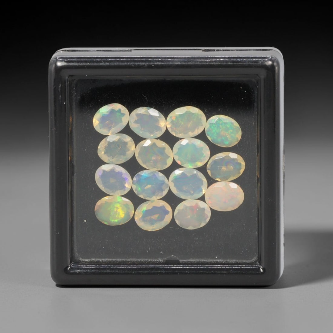 2.73 Carats Natural Ethiopian Welo Opal - Oval Faceted Loose Gemstone Lot, 1WE: Natural oval-faceted Welo opal lot, sourced from the premium Welo deposit in Ethiopia. This curated collection features exceptional opals with vivid, full-spectrum play-of-color-flashing fiery reds, w