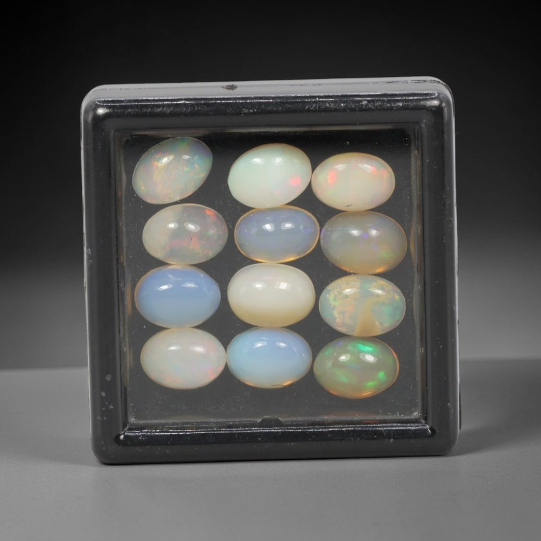 6.70 Carats Natural Ethiopian Welo Opal - Oval Cabochon Loose Gemstone Lot, 9WE: Natural oval cabochon Welo opal lot, sourced from the premium Welo deposit in Ethiopia. This curated collection features 12 exceptional opals with a stunning range of base tones-from icy sky blue, mil