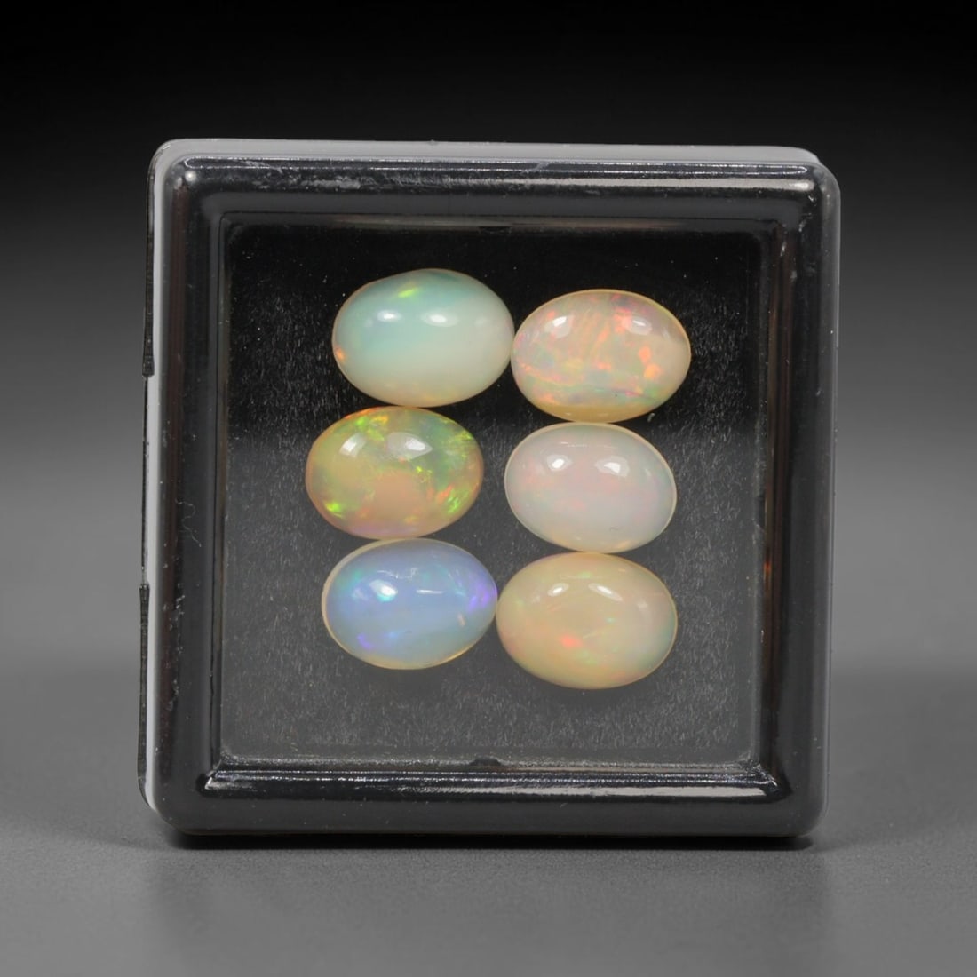 4.58 Carats Natural Ethiopian Welo Opal - Oval Cabochon Loose Gemstone Lot, 46WE: Natural oval cabochon Welo opal lot, sourced from the premium Welo deposit in Ethiopia. This curated collection features 12 exceptional opals with a stunning range of base tones-from icy sky blue, mil