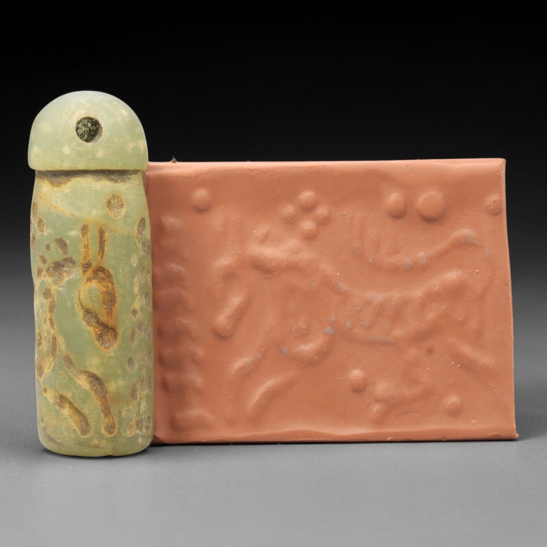 Ancient Serpentine Cylinder Seal - Mesopotamian, 51ZT: Carved from serpentine, this cylinder seal follows the classic cylindrical form of ancient Mesopotamian administrative and ritual artifacts. Attributed to the Bronze Age Mesopotamian cultures, this se