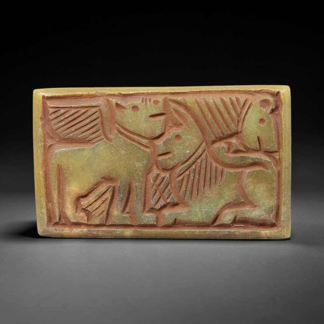 Near Eastern Serpentine Plaque - Tribal Art Figure & Animal Relief, 48BF: Carved from serpentine, this rectangular plaque features a deeply incised relief composition with a stylized human figure and a quadrupedal animal form, rendered in a bold, linear tribal aesthetic. Th